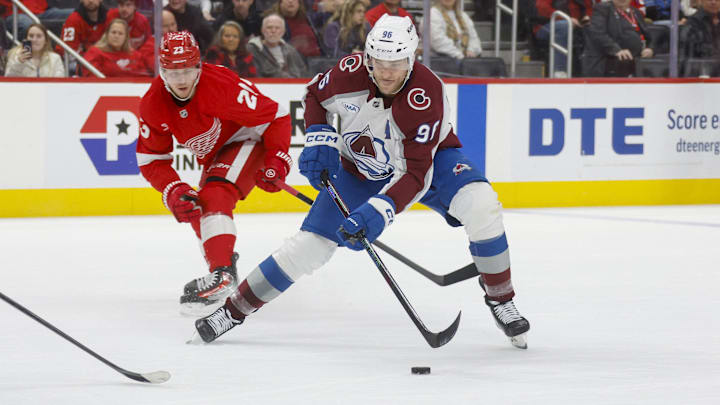 Dec 7, 2024; Detroit, Michigan, USA; Colorado Avalanche right wing Mikko Rantanen (96) handles the puck against the Detroit Red Wings during the first period at Little Caesars Arena. Mandatory Credit: Brian Bradshaw Sevald-Imagn Images