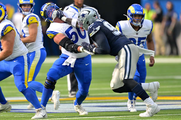 Los Angeles Rams center Beaux Limmer and Dallas Cowboys defensive tackle Perrion Winfrey battle on the line.
