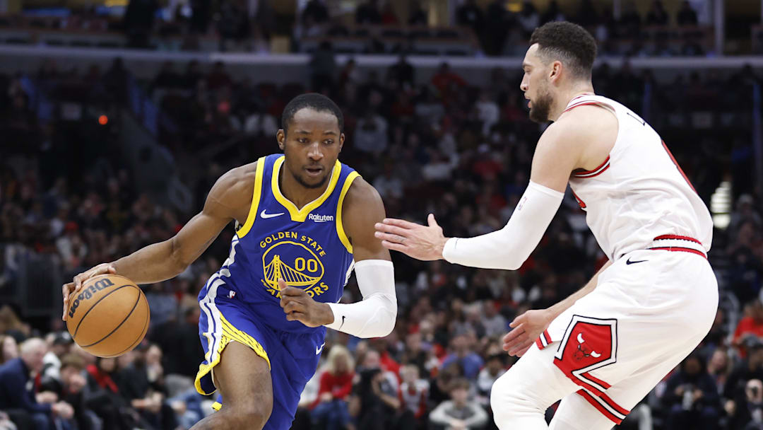 Jan 12, 2024; Chicago, Illinois, USA; Golden State Warriors forward Jonathan Kuminga (00) dribbles against Chicago Bulls guard Zach LaVine (8) during the first half at United Center. Mandatory Credit: Kamil Krzaczynski-Imagn Images Jan 12, 2024; Chicago, Illinois, USA; Golden State Warriors forward Jonathan Kuminga (00) dribbles against Chicago Bulls guard Zach LaVine (8) during the first half at United Center. Mandatory Credit: Kamil Krzaczynski-Imagn Images