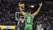 Jan 2, 2025; Minneapolis, Minnesota, USA; Boston Celtics forward Jayson Tatum (0) celebrates after making a shot against the Minnesota Timberwolves in the second half at Target Center. Mandatory Credit: Jesse Johnson-Imagn Images