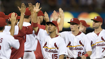 August 13, 2010; St. Louis, MO. USA; St. Louis Cardinals right fielder Jon Jay (15) center fielder Colby Rasmus (28) and left fielder Matt Holliday (7) high five teammates fater defeating the Chicago Cubs six to three at Busch Stadium. Mandatory Credit: Jeff Curry-Imagn Images