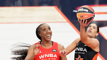 Los Angeles Sparks's Kelsey Plum (10) pushes past Seattle Storm's Gabby Williams (5) on her way to the basket Saturday, July 19, 2025, during the WNBA All-Star Game at Gainbridge Fieldhouse in Indianapolis.
