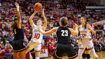 Indiana's Shay Ciezki (10) scores as she is fouled by Bellarmine's Skylar Treadwell (6) during the Indiana versus Bellarmine women's basketball game at Simon Skjodt Assembly Hall on Sunday, Dec. 15, 2024.