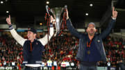 Wrexham co-owners Rob McElhenney (left) and Ryan Reynolds hoist aloft the National League trophy