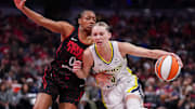 Indiana Fever guard Kelsey Mitchell (0) rushes up the court against Dallas Wings guard Paige Bueckers (5) on Tuesday, Aug. 12, 2025, during the game at Gainbridge Fieldhouse in Indianapolis. The Dallas Wings defeated the Indiana Fever, 81-80.