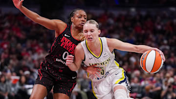 Indiana Fever guard Kelsey Mitchell (0) rushes up the court against Dallas Wings guard Paige Bueckers (5) on Tuesday, Aug. 12, 2025, during the game at Gainbridge Fieldhouse in Indianapolis. The Dallas Wings defeated the Indiana Fever, 81-80.