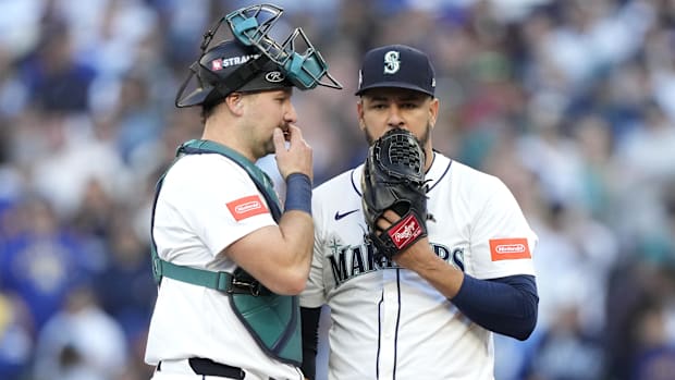  Seattle Mariners pitcher Luis Castillo (58) and catcher Cal Raleigh (29) meet on the mound
