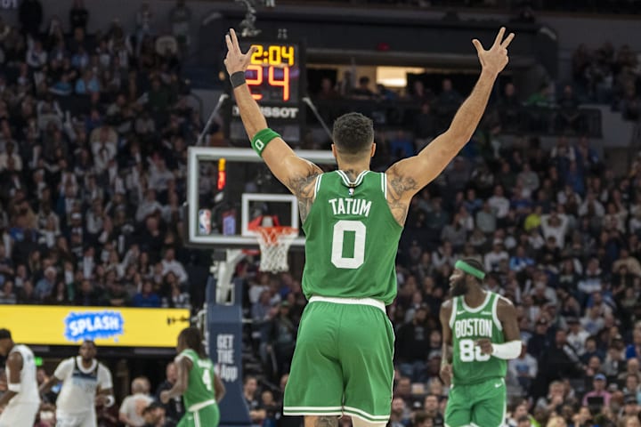 Boston Celtics forward Jayson Tatum celebrates after making a shot against the Minnesota Timberwolves.