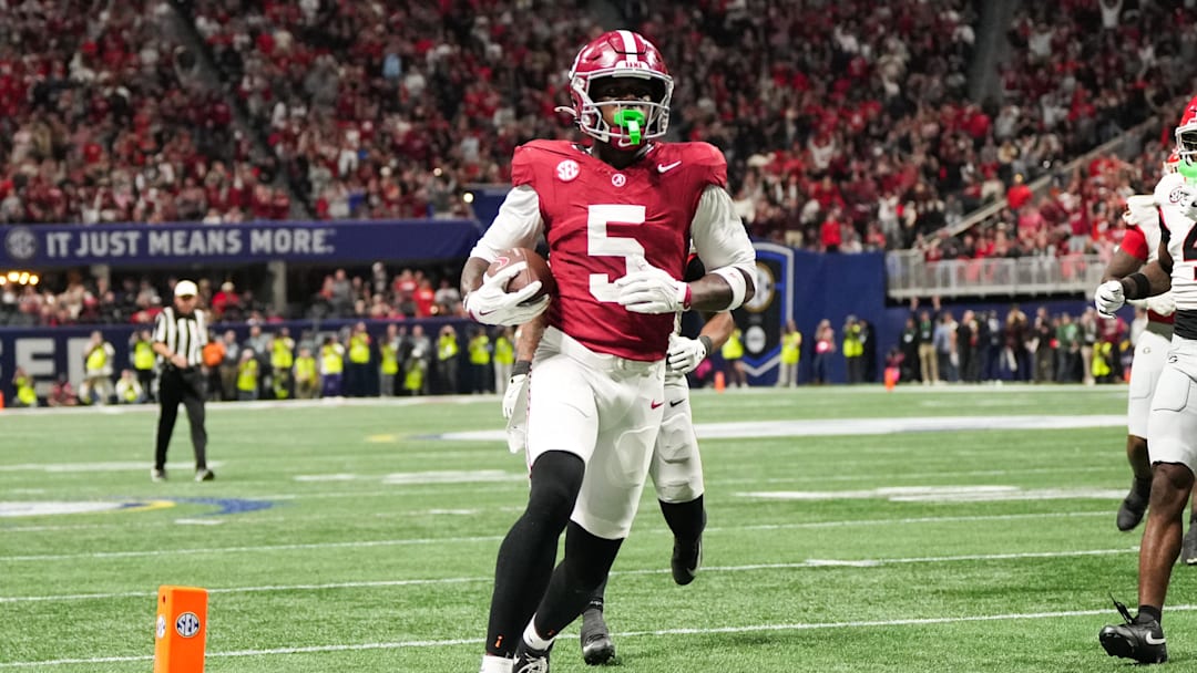 Dec 6, 2025; Atlanta, GA, USA; Alabama Crimson Tide wide receiver Germie Bernard (5) scores a touchdown during the fourth quarter against the Georgia Bulldogs during the 2025 SEC Championship game at Mercedes-Benz Stadium. 