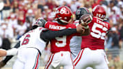 Oct 19, 2024; Norman, Oklahoma, USA; South Carolina Gamecocks edge Dylan Stewart (6) hits Oklahoma Sooners quarterback Michael Hawkins Jr. (9) and causes an interception during the first half at Gaylord Family-Oklahoma Memorial Stadium. Mandatory Credit: Kevin Jairaj-Imagn Images