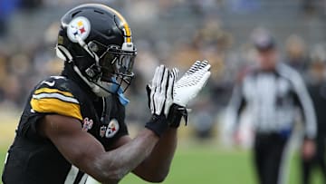 Dec 25, 2024; Pittsburgh, Pennsylvania, USA;  Pittsburgh Steelers wide receiver George Pickens (14) reacts after a Kansas City Chiefs penalty during the fourth quarter at Acrisure Stadium. Mandatory Credit: Charles LeClaire-Imagn Images