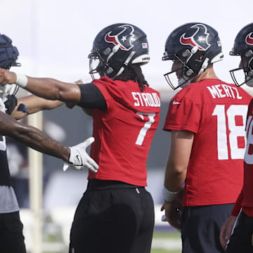 Jul 24, 2025; Houston, TX, USA; Houston Texans wide receiver Nico Collins (12) and quarterback C.J. Stroud (7) during training camp at Houston Methodist Training Center. Mandatory Credit: Troy Taormina-Imagn Images