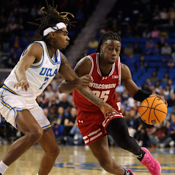 Wisconsin and UCLA is set at a near coin flip in Friday's Big Ten action.