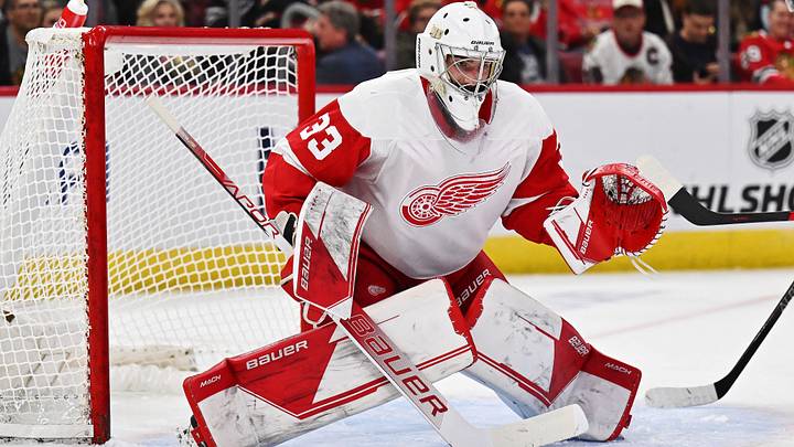 Oct 1, 2022; Chicago, Illinois, USA;  Detroit Red Wings goaltender Sebastian Cossa (33) defends the net against the Chicago Blackhawks at United Center. Mandatory Credit: Jamie Sabau-Imagn Images