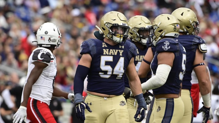 Oct 23, 2021; Annapolis, Maryland, USA; Navy Midshipmen linebacker Diego Fagot (54) and  linebacker Nicholas Straw (51) talks on the field after the play during the second half against the Cincinnati Bearcats   at Navy-Marine Corps Memorial Stadium. Mandatory Credit: Tommy Gilligan-USA TODAY Sports