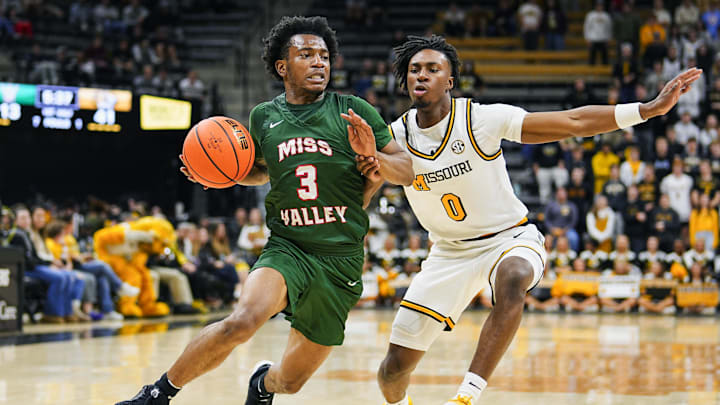Nov 14, 2024; Columbia, Missouri, USA; Mississippi Valley State Delta Devils guard Donovan Sanders (3) drives against Missouri Tigers guard Anthony Robinson II (0) during the first half at Mizzou Arena. Mandatory Credit: Jay Biggerstaff-Imagn Images
