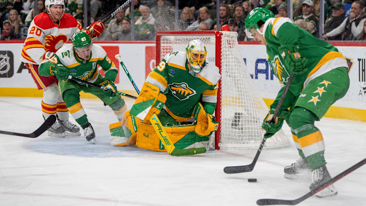 Jan 25, 2025; Saint Paul, Minnesota, USA; Minnesota Wild defenseman Brock Faber (7) plays the puck in front of goaltender Marc-Andre Fleury (29) against the Calgary Flames in the third period at Xcel Energy Center. Mandatory Credit: Matt Blewett-Imagn Images Jan 25, 2025; Saint Paul, Minnesota, USA; Minnesota Wild defenseman Brock Faber (7) plays the puck in front of goaltender Marc-Andre Fleury (29) against the Calgary Flames in the third period at Xcel Energy Center. Mandatory Credit: Matt Blewett-Imagn Images