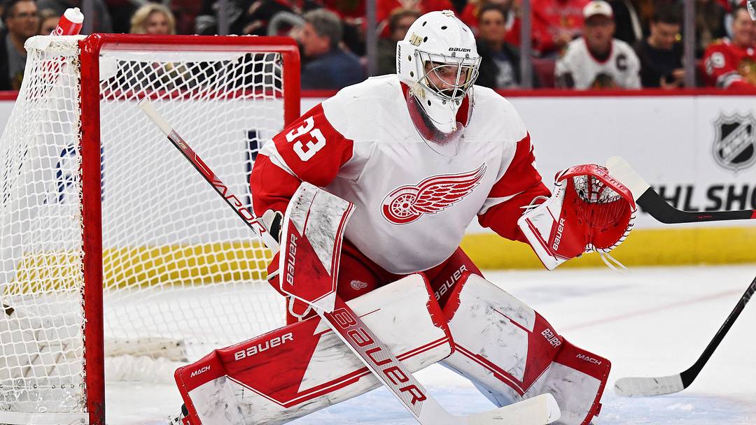 Oct 1, 2022; Chicago, Illinois, USA;  Detroit Red Wings goaltender Sebastian Cossa (33) defends the net against the Chicago Blackhawks at United Center. Mandatory Credit: Jamie Sabau-Imagn Images