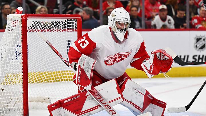 Oct 1, 2022; Chicago, Illinois, USA;  Detroit Red Wings goaltender Sebastian Cossa (33) defends the net against the Chicago Blackhawks at United Center. Mandatory Credit: Jamie Sabau-Imagn Images