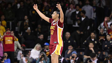 Feb 13, 2025; Los Angeles, California, USA; USC Trojans guard JuJu Watkins (12) celebrates as the clock runs out in the Trojans win over the UCLA Bruins at Galen Center. Mandatory Credit: Robert Hanashiro-Imagn Images