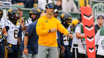 Sep 6, 2025; Athens, Ohio, USA; West Virginia Mountaineers defensive coordinator Zac Alley calls out plays from the sidelines during the first quarter against the West Virginia Mountaineers at Peden Stadium. Mandatory Credit: Ben Queen-Imagn Images