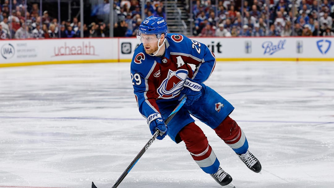 May 13, 2026; Denver, Colorado, USA; Colorado Avalanche center Nathan MacKinnon (29) controls the puck in overtime against the Minnesota Wild in game five of the second round of the 2026 Stanely Cup Playoffs at Ball Arena. Mandatory Credit: Isaiah J. Downing-Imagn Images