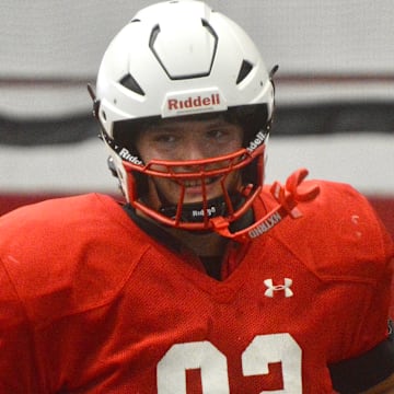 2027 in-state offensive lineman Hunter Mallinger (Sussex Hamilton) jogs off the field after a drill during Wisconsin football's June 15 camp.