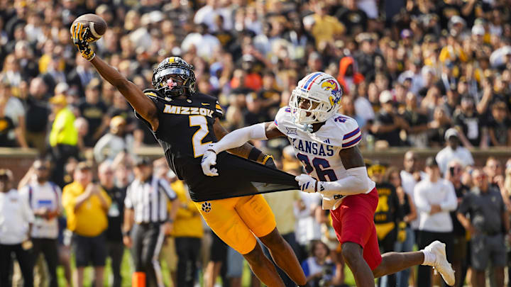 Sep 6, 2025; Columbia, Missouri, USA; Missouri Tigers wide receiver Marquis Johnson (2) is unable to make a catch against Kansas Jayhawks defensive back Jalen Todd (26) during the first half at Faurot Field at Memorial Stadium. Mandatory Credit: Jay Biggerstaff-Imagn Images