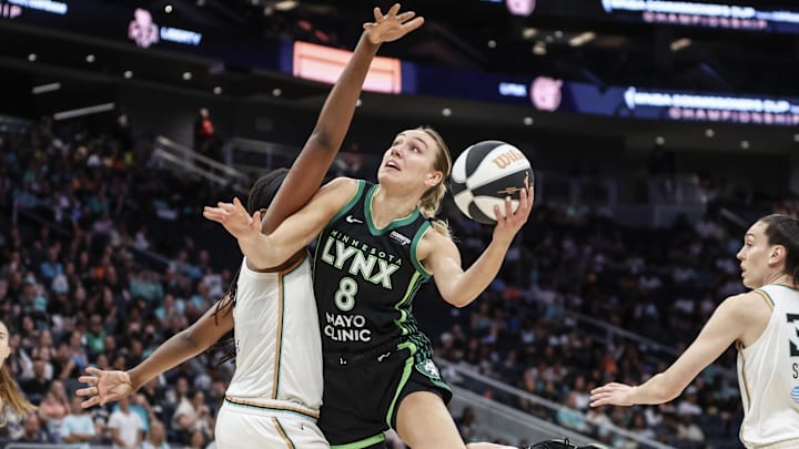 Jun 25, 2024; Belmont Park, New York, USA; Minnesota Lynx forward Alanna Smith (8) drives past New York Liberty forward Jonquel Jones (35)in the first quarter of the Commissioner’s Cup Championship game at UBS Arena. Mandatory Credit: Wendell Cruz-Imagn Images