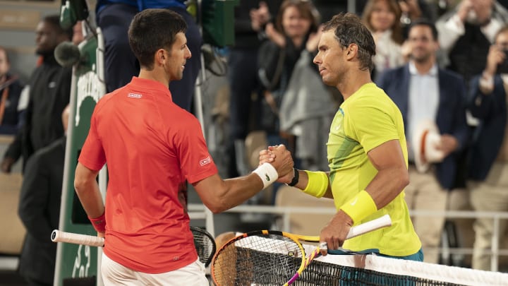 May 31, 2022; Paris, France; Rafael Nadal (ESP) at the net with Novak Djokovic (SRB) after their match on day 10 of the French Open at Stade Roland-Garros. Nadal won 6-2, 4-6, 6-2, 7-6 (4). Mandatory Credit: Susan Mullane-USA TODAY Sports