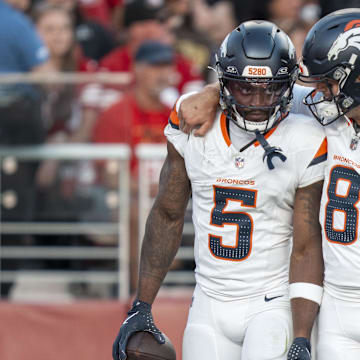 August 9, 2025; Santa Clara, California, USA; Denver Broncos wide receiver Trent Sherfield Sr. (5) is congratulated by quarterback Jarrett Stidham (8) for scoring a touchdown against the San Francisco 49ers during the second quarter at Levi's Stadium. 