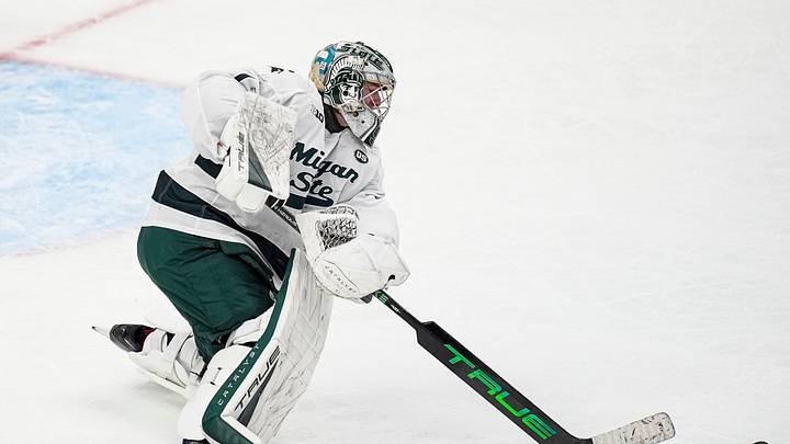 Michigan State goaltender Trey Augustine (1) hits the puck away against Michigan during the second period of Duel in the D at Little Caesars Arena in Detroit on Saturday, February 7, 2026.