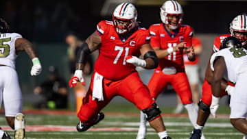 Oct 19, 2024; Tucson, Arizona, USA; Arizona Wildcats offensive lineman Jonah Savaiinaea (71) against the Colorado Buffalos at Arizona Stadium. Mandatory Credit: Mark J. Rebilas-Imagn Images
