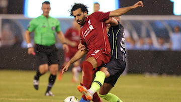 Jul 25, 2018; East Rutherford, NJ, USA; Liverpool forward Mohamed Salah (11) plays the ball against Manchester City midfielder Oleksandr Zinchenko (35) during the second half of an International Champions Cup soccer match at MetLife Stadium. Mandatory Credit: Brad Penner-Imagn Images