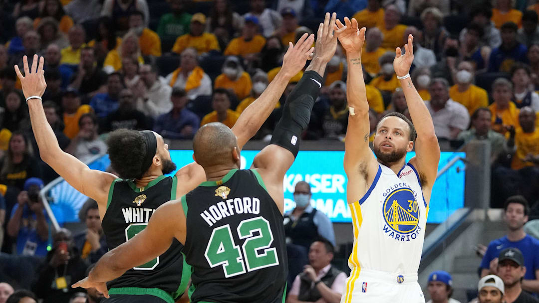 Jun 13, 2022; San Francisco, California, USA; Golden State Warriors guard Stephen Curry (30) shoots the ball over Boston Celtics guard Derrick White (9) and forward Al Horford (42) during the first half in game five of the 2022 NBA Finals at Chase Center. Mandatory Credit: Kyle Terada-Imagn Images