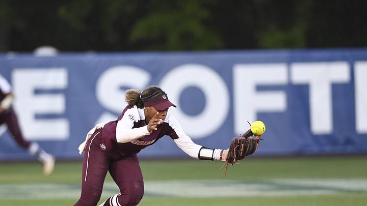 May 10, 2024; Auburn, AL, USA;  Texas A&M Aggies infielder Koko Wooley (3) bobbles a ground ball against the Florida Gators at Jane B. Moore Field. Mandatory Credit: Julie Bennett-Imagn Images