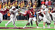 Oct 25, 2024; Chestnut Hill, Massachusetts, USA; Louisville Cardinals defensive lineman Dezmond Tell (99) blocks the arm of Boston College Eagles quarterback Thomas Castellanos (1) during the second half at Alumni Stadium. Mandatory Credit: Eric Canha-Imagn Images