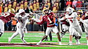 Oct 25, 2024; Chestnut Hill, Massachusetts, USA; Louisville Cardinals defensive lineman Dezmond Tell (99) blocks the arm of Boston College Eagles quarterback Thomas Castellanos (1) during the second half at Alumni Stadium. Mandatory Credit: Eric Canha-Imagn Images