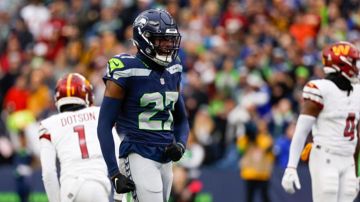 Nov 12, 2023; Seattle, Washington, USA; Seattle Seahawks cornerback Riq Woolen (27) reacts after a pass defense against the Washington Commanders during the second quarter at Lumen Field. Mandatory Credit: Joe Nicholson-USA TODAY Sports