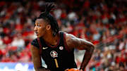 Dec 7, 2024; Raleigh, North Carolina, USA; Florida State Seminoles guard Jamir Watkins (1) holds the ball during the second half of the game against North Carolina State Wolfpack at Lenovo Center. Mandatory Credit: Jaylynn Nash-Imagn Images