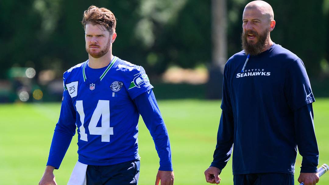 Seattle Seahawks quarterback Sam Darnold and offensive coordinator Brian Fleury during minicamp.
