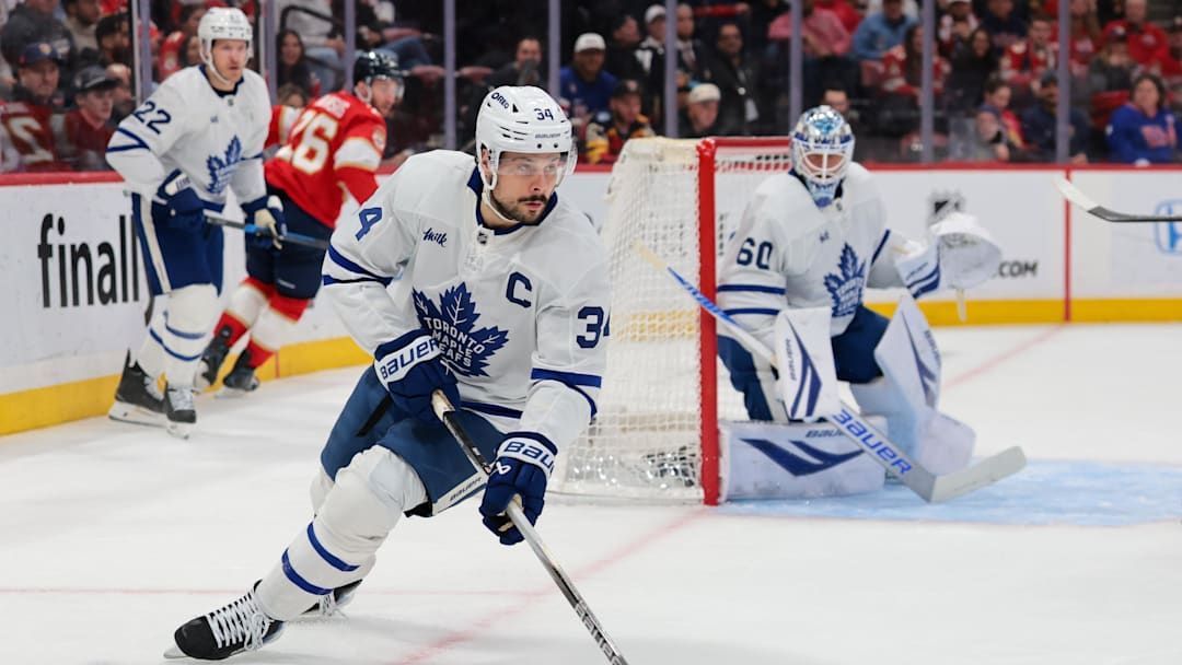 Feb 26, 2026; Sunrise, Florida, USA; Toronto Maple Leafs center Auston Matthews (34) moves the puck against the Florida Panthers during the first period at Amerant Bank Arena. Mandatory Credit: Sam Navarro-Imagn Images