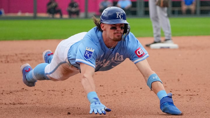 Jul 21, 2024; Kansas City, Missouri, USA; Kansas City Royals shortstop Bobby Witt Jr. (7) slides into third base against the Chicago White Sox in the eight inning at Kauffman Stadium. Mandatory Credit: Denny Medley-USA TODAY Sports