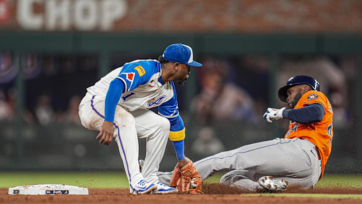 Atlanta Braves second baseman Ozzie Albies (1) tags out Houston Astros left fielder Yordan Alvarez (44) as he attempted to steal second base during the eighth inning at Truist Park on Sept. 13