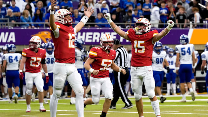 Kuemper Catholic’s Brock Badding (12) and Charles Mayhall (15) celebrate in the fourth quarter Nov. 21, 2025 during the Class 2A high school state football championship Van Meter’s at the UNI-Dome in Cedar Falls, Iowa.` Kuemper Catholic’s Brock Badding (12) and Charles Mayhall (15) celebrate in the fourth quarter Nov. 21, 2025 during the Class 2A high school state football championship Van Meter’s at the UNI-Dome in Cedar Falls, Iowa.`