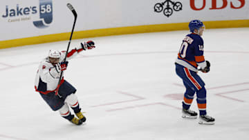 Apr 6, 2025; Elmont, New York, USA;  Washington Capitals left wing Alex Ovechkin (8) scores a goal in the 2nd period against the New York Islanders at UBS Arena. The goal is the 895th of Ovechkin’s career, breaking the NHL all-time career goals record previously held by Wayne Gretzky.at UBS Arena. Mandatory Credit: Geoff Burke-Imagn Images