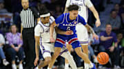 Feb 8, 2025; Manhattan, Kansas, USA; Kansas State Wildcats guard Dug McDaniel (0) and Kansas Jayhawks guard Zeke Mayo (5) go after a loose ball during the second half at Bramlage Coliseum. Mandatory Credit: Scott Sewell-Imagn Images