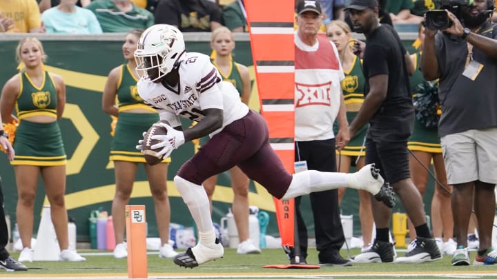 Sep 2, 2023; Waco, Texas, USA; Texas State Bobcats running back Ismail Mahdi (21) goes in for the 10-yard touchdown catch Baylor Bears during the first half at McLane Stadium. Mandatory Credit: Raymond Carlin III-USA TODAY Sports