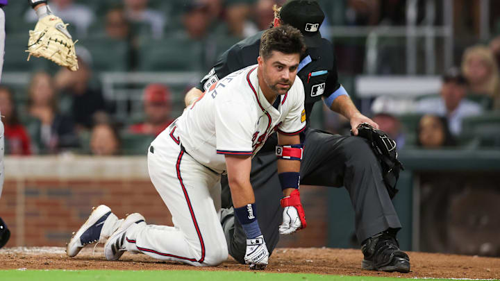 Sep 3, 2024; Atlanta, Georgia, USA; Atlanta Braves second baseman Whit Merrifield (15) on ground after being hit in the head with a pitch against the Colorado Rockies in the seventh inning at Truist Park. Mandatory Credit: Brett Davis-Imagn Images 
