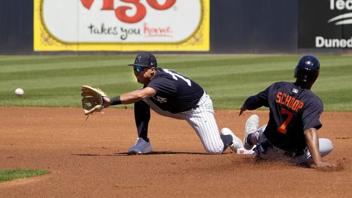 Mar 21, 2023; Tampa, Florida, USA; Detroit Tigers second baseman Jonathan Schoop (7) slides into